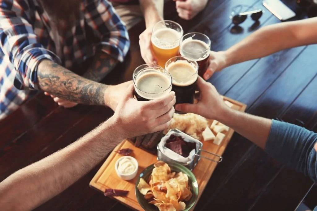 People cheering in a newly opened bar
